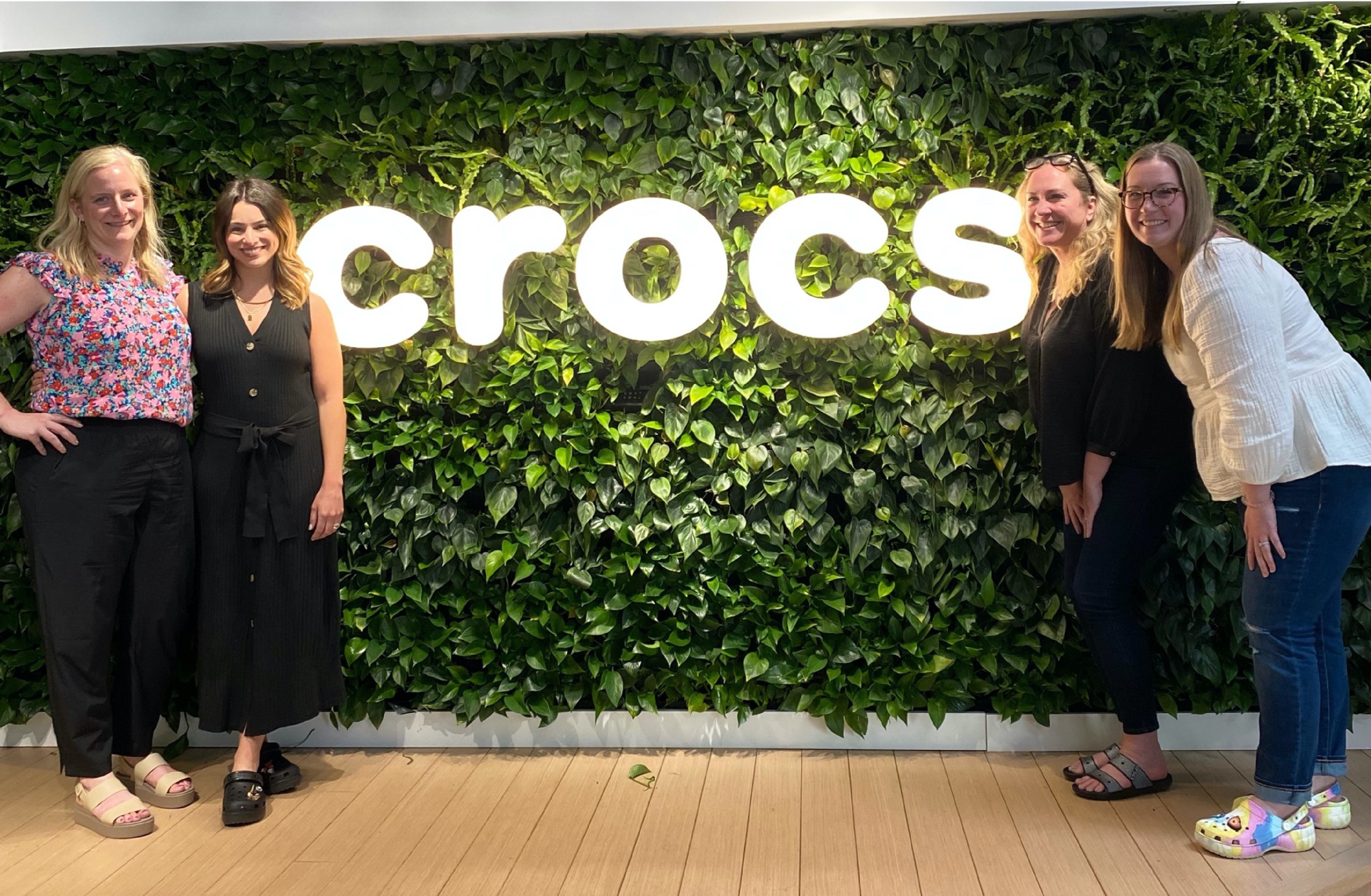 Digitas posing in front of Crocs logo