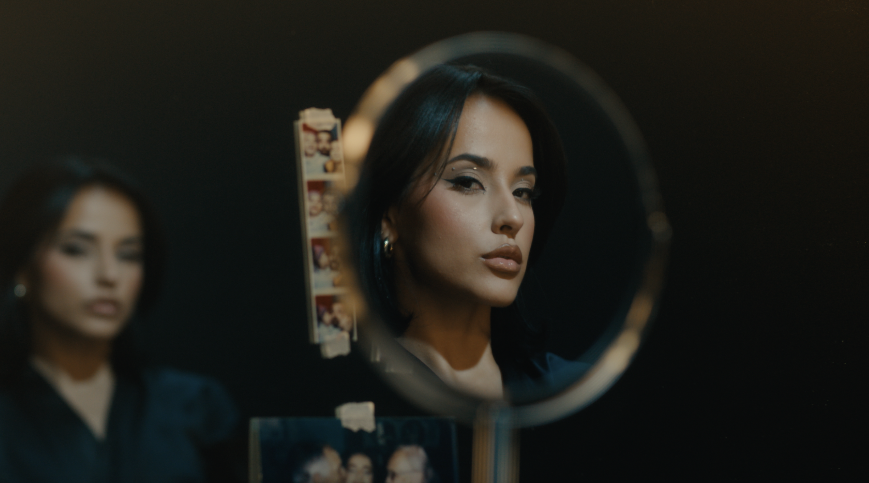 woman staring into mirror